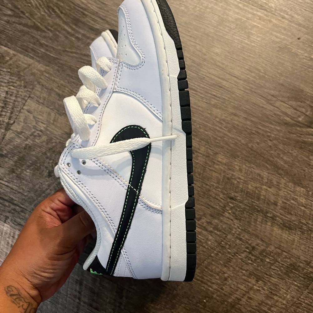 White and Black Sneakers with Green Accents